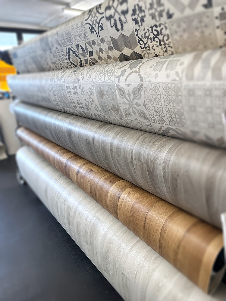 Rolls of sheet vinyl on the rack in store, ready to cut to length and take away today